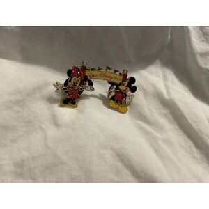 Walt Disney World Marquee pin featuring Mickey and Minnie Mouse.